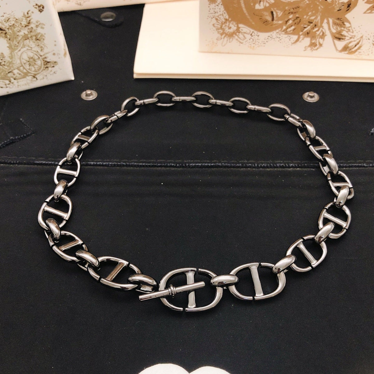 Martin Graham pendant necklace in polished metal-tone – detail view