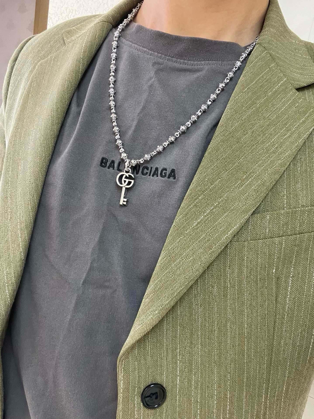 Martin Graham pendant necklace in polished metal-tone – detail view