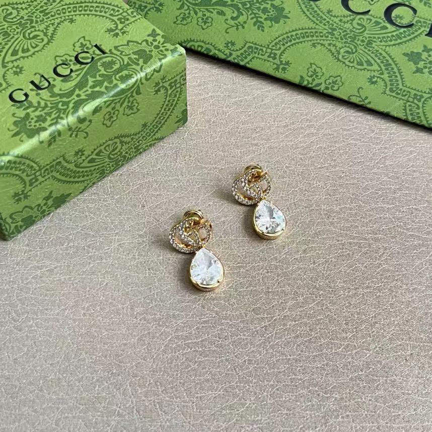 Martin Graham stud earrings in polished metal-tone – detail view