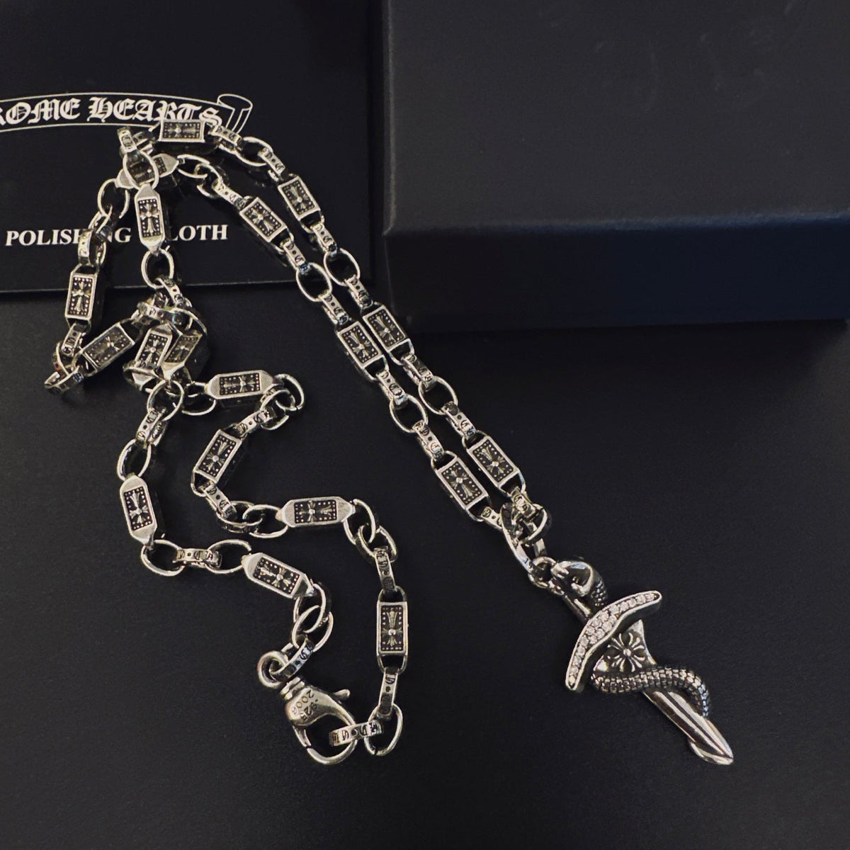 Martin Graham pendant necklace in polished metal-tone – detail view