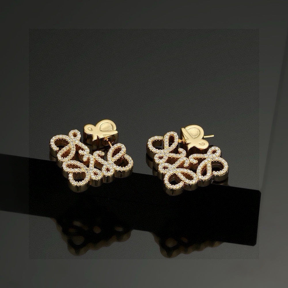Martin Graham stud earrings in polished metal-tone – detail view
