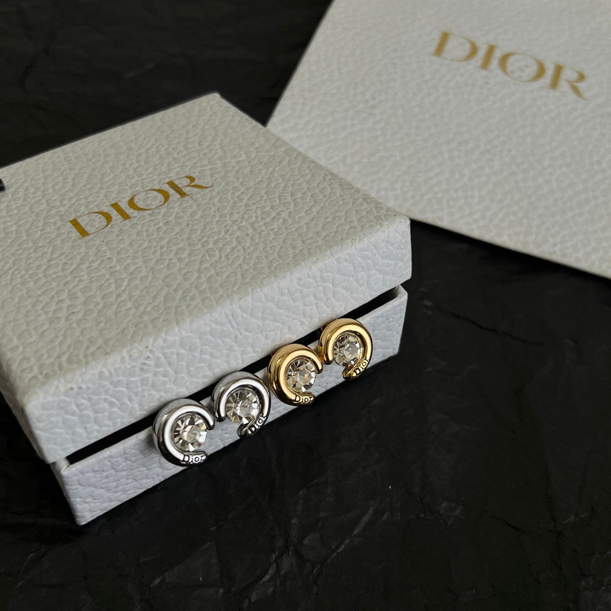 Martin Graham stud earrings in polished metal-tone – detail view