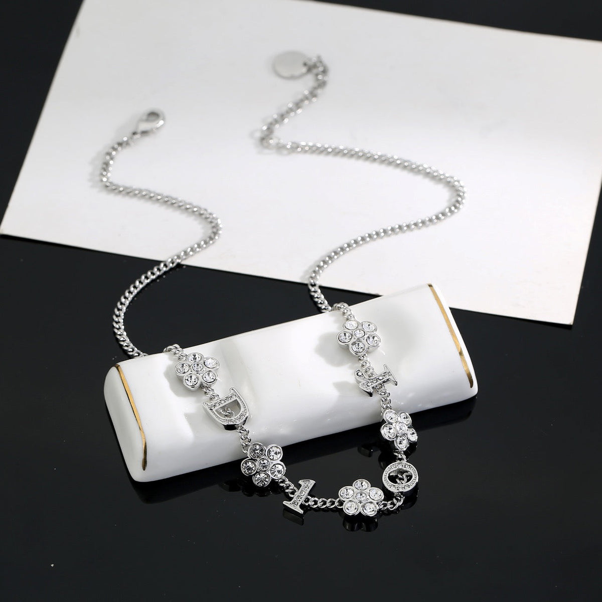 Martin Graham pendant necklace in polished metal-tone – detail view