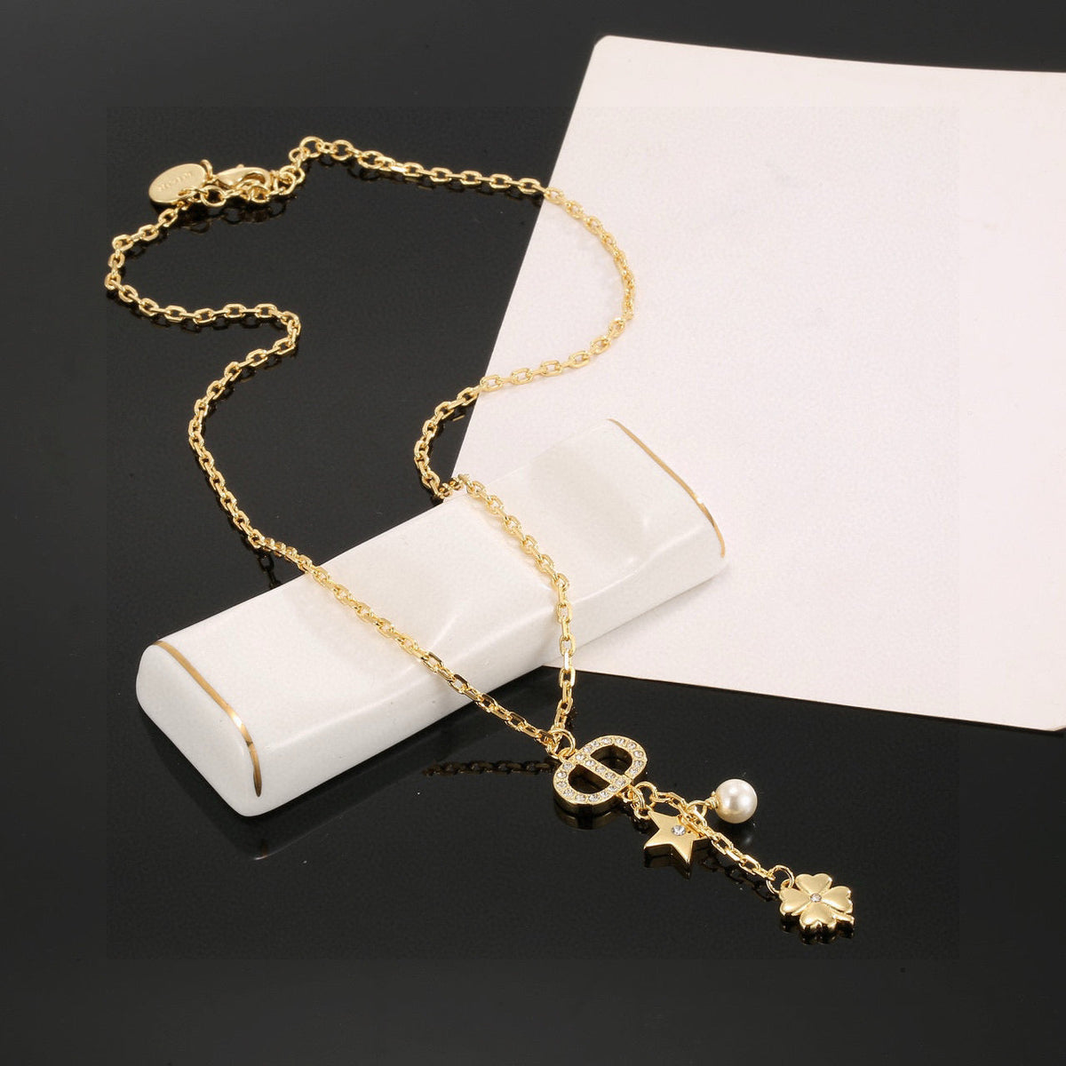 Martin Graham pendant necklace in polished metal-tone – detail view