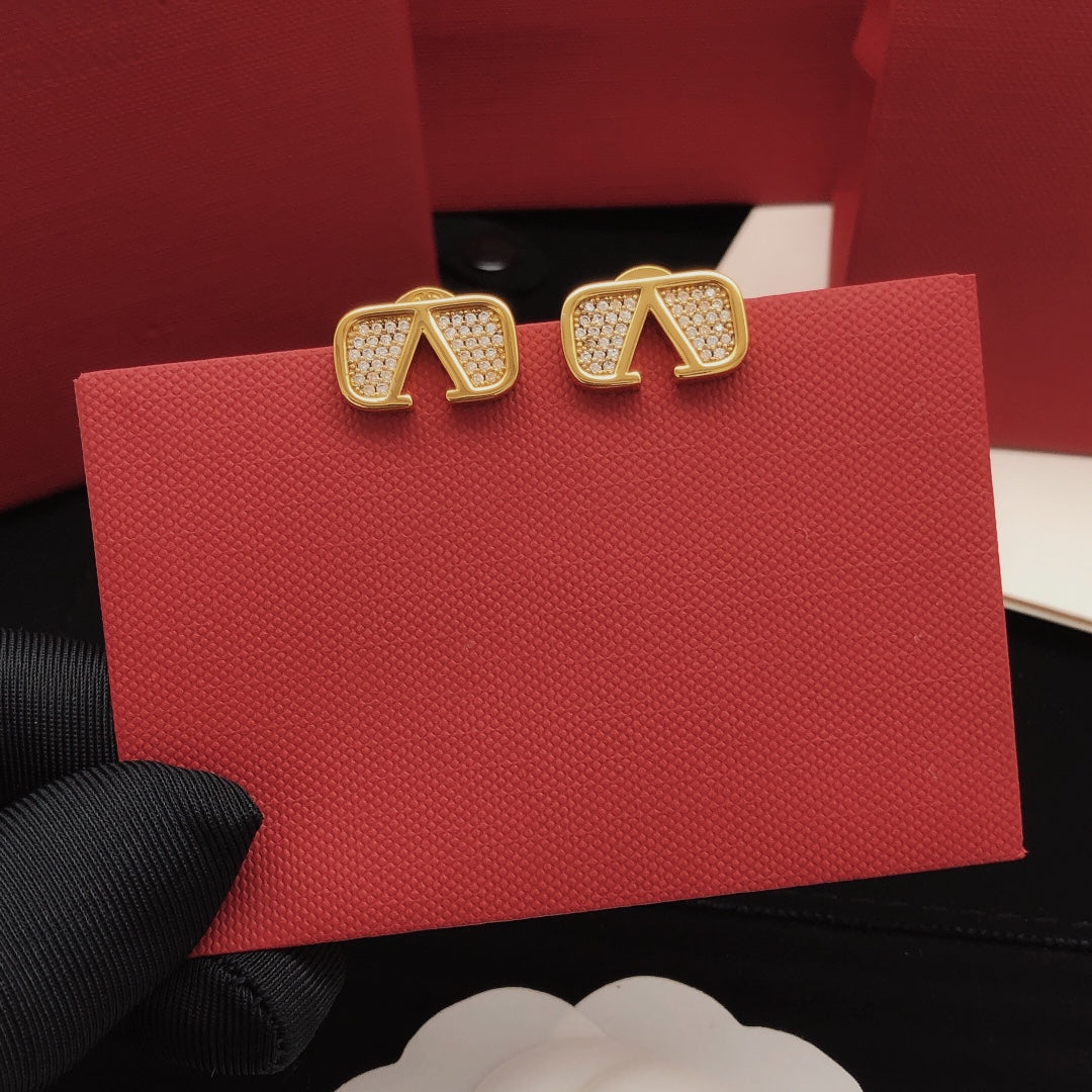 Martin Graham stud earrings in polished metal-tone – detail view