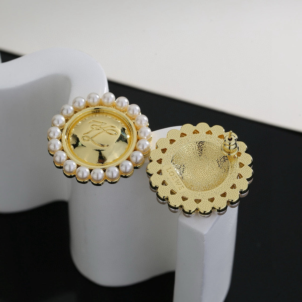 Martin Graham stud earrings in polished metal-tone – detail view