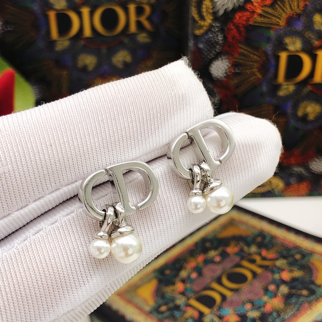 Martin Graham stud earrings in polished metal-tone – detail view