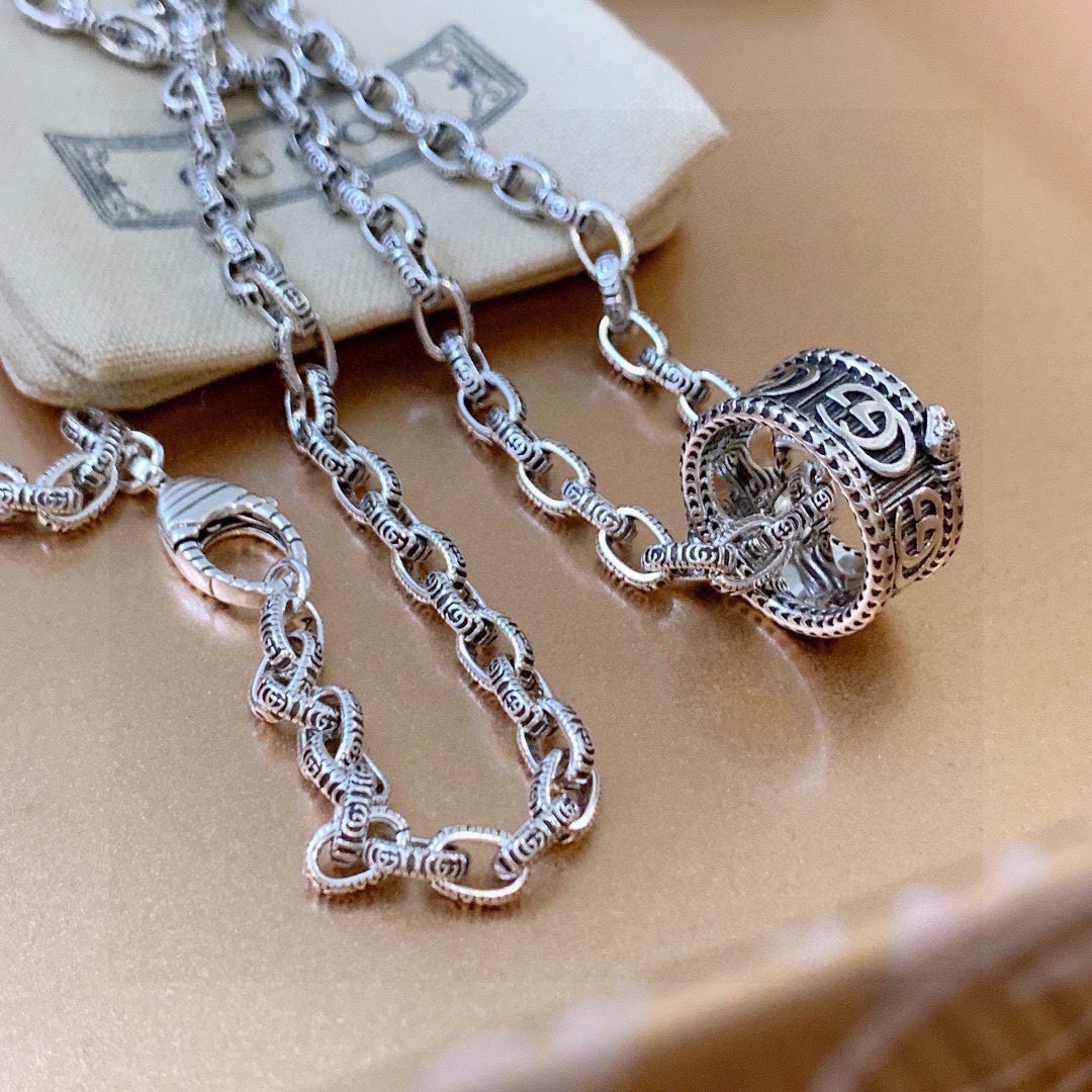 Martin Graham pendant necklace in polished metal-tone – detail view