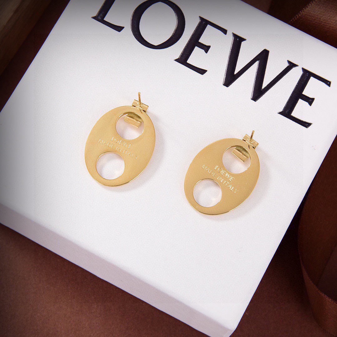 Martin Graham stud earrings in polished metal-tone – detail view