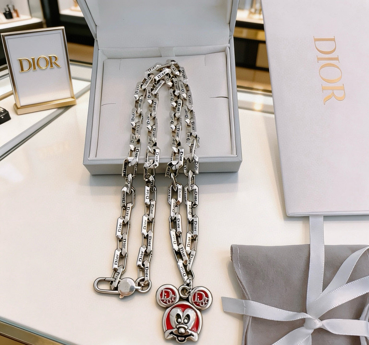 Martin Graham pendant necklace in polished metal-tone – detail view