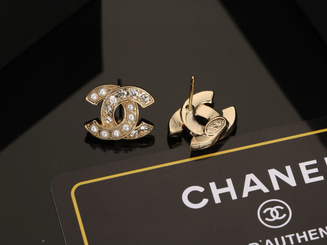 Martin Graham stud earrings in polished metal-tone – detail view