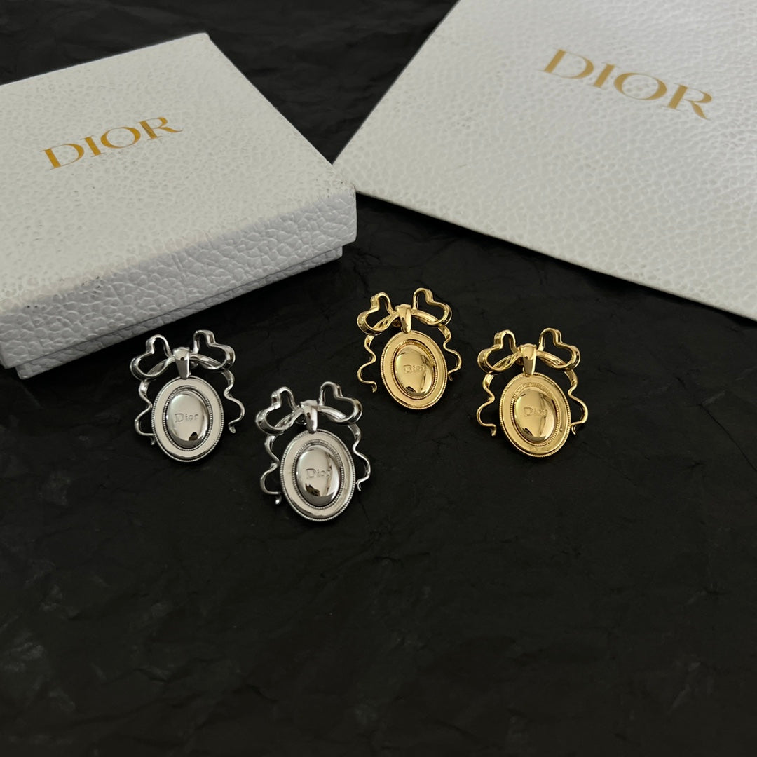 Martin Graham stud earrings in polished metal-tone – detail view