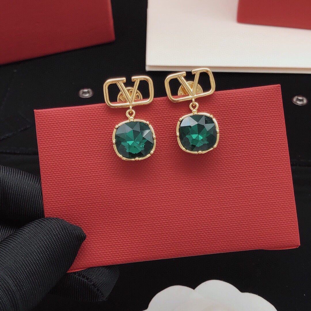 Martin Graham stud earrings in polished metal-tone – detail view