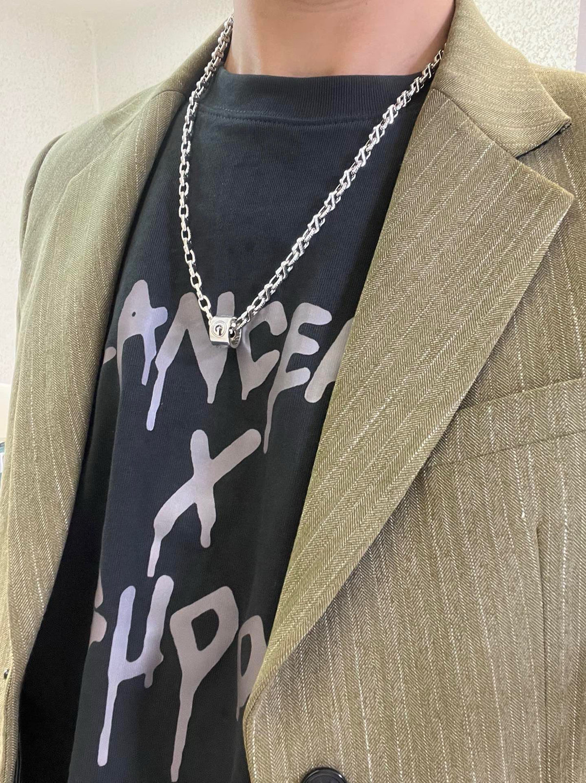 Martin Graham pendant necklace in polished metal-tone – detail view