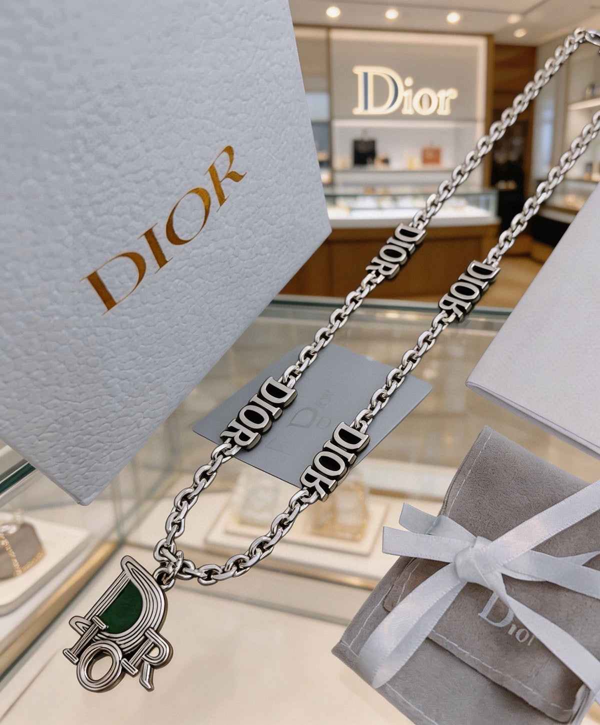 Martin Graham pendant necklace in polished metal-tone – detail view