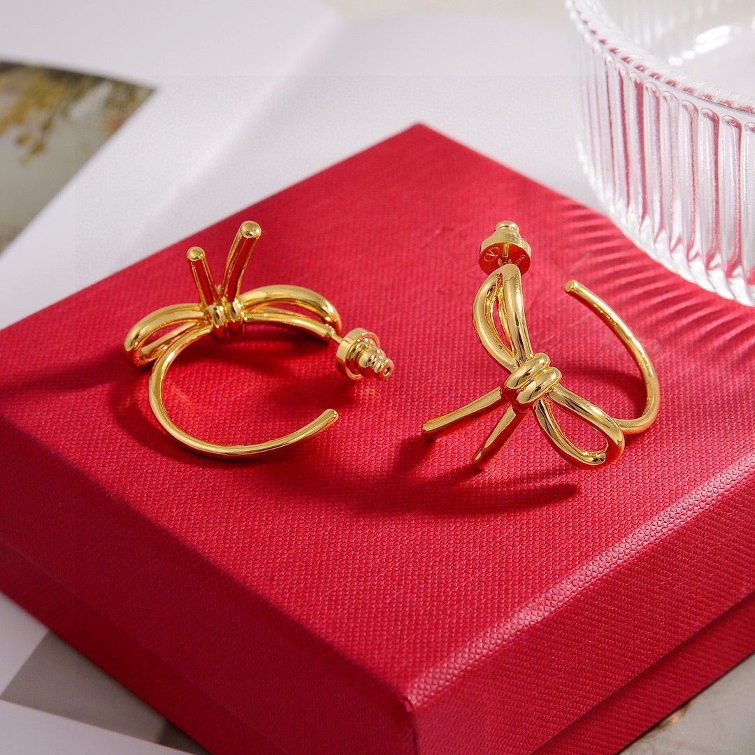 Martin Graham stud earrings in polished metal-tone – detail view