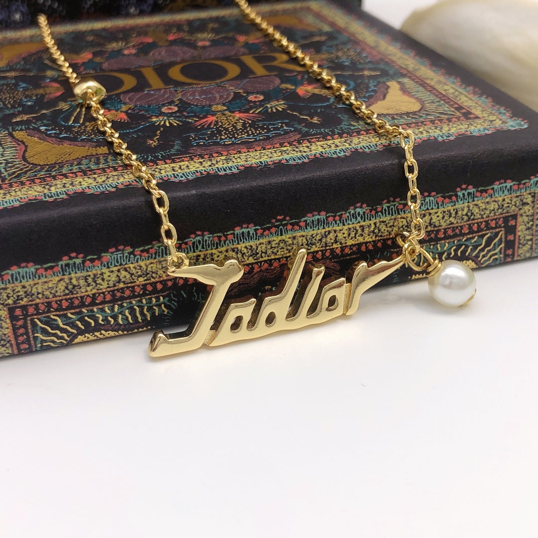 Martin Graham pendant necklace in polished metal-tone – detail view