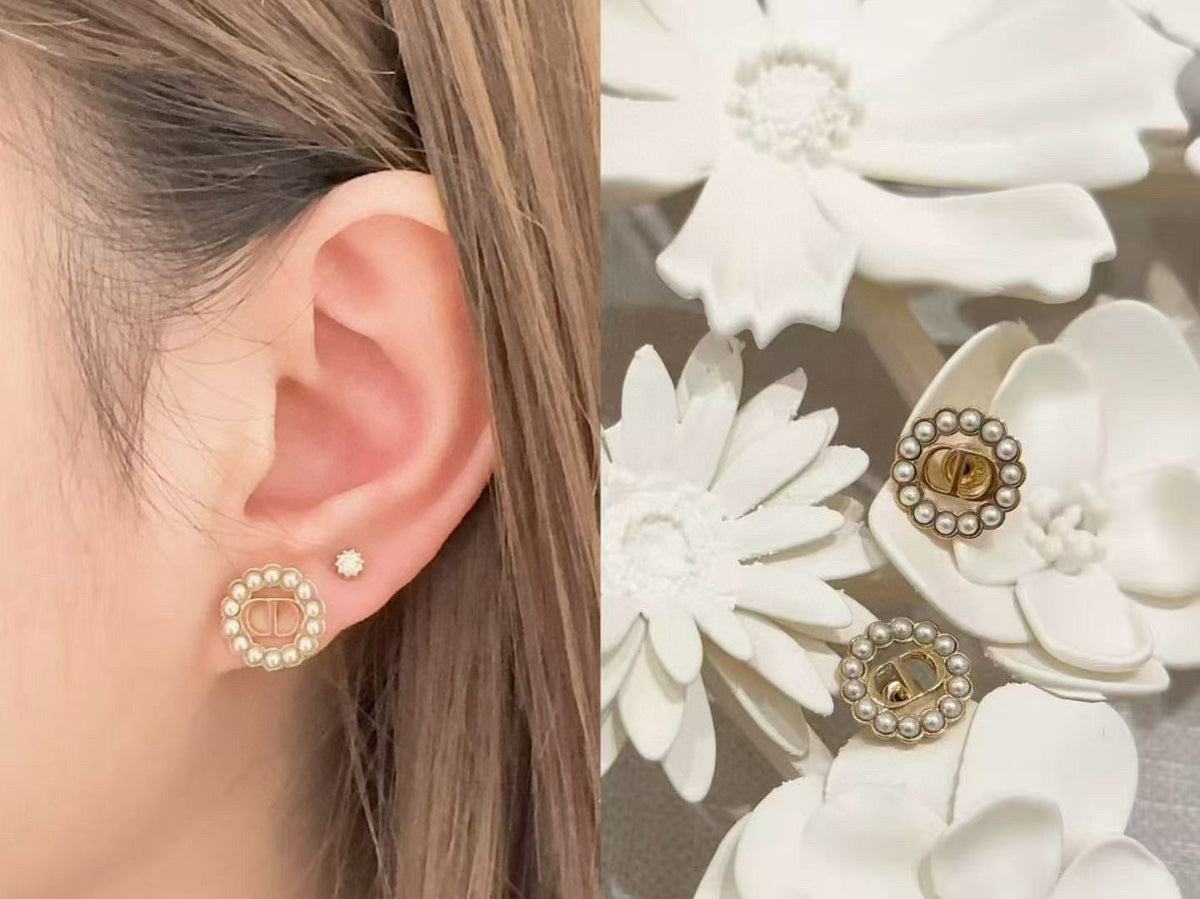Martin Graham stud earrings in polished metal-tone – detail view