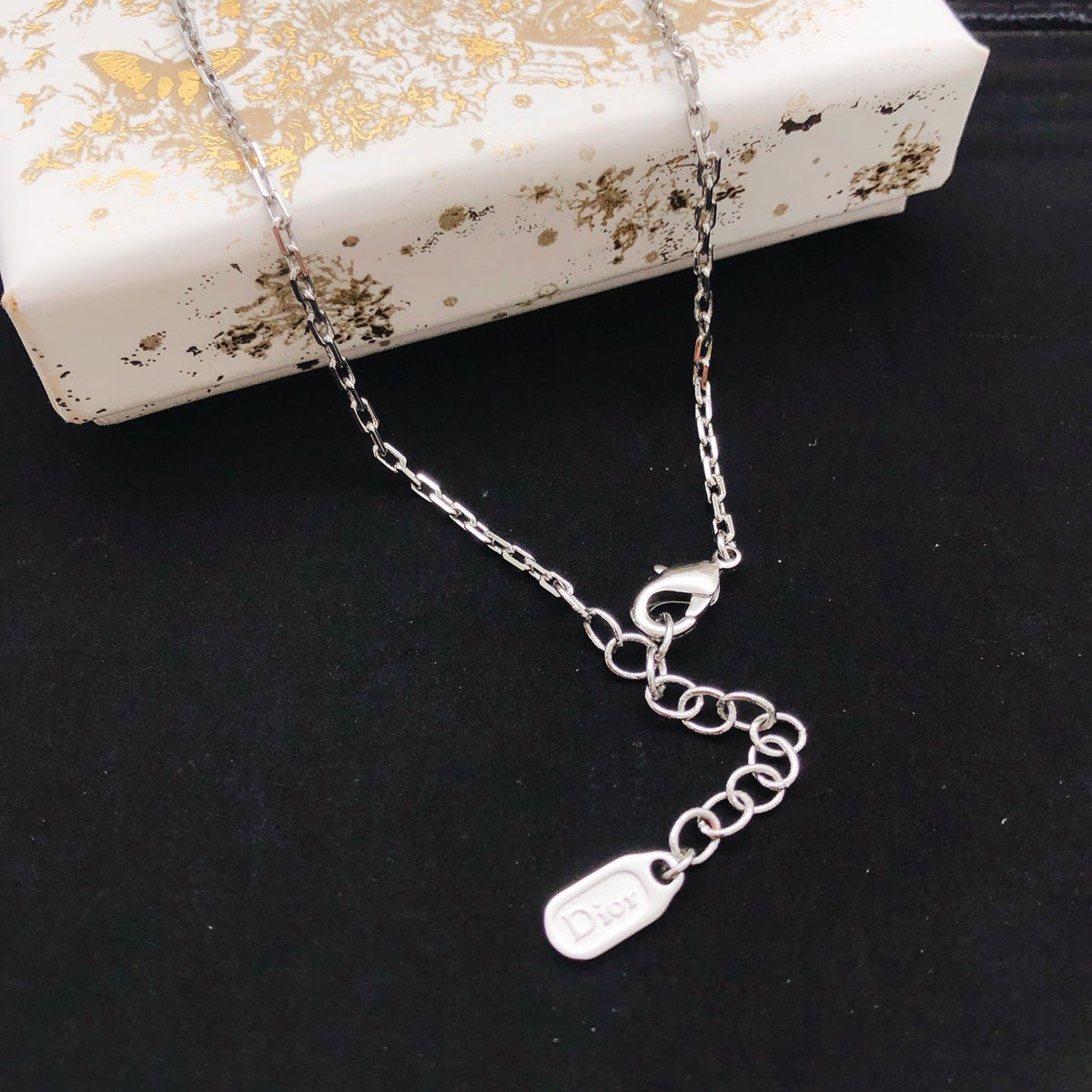 Martin Graham pendant necklace in polished metal-tone – detail view