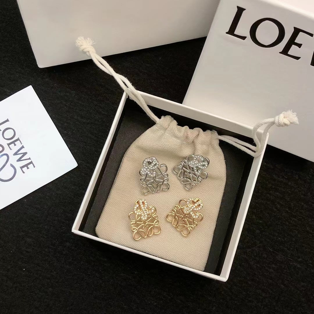 Martin Graham stud earrings in polished metal-tone – detail view