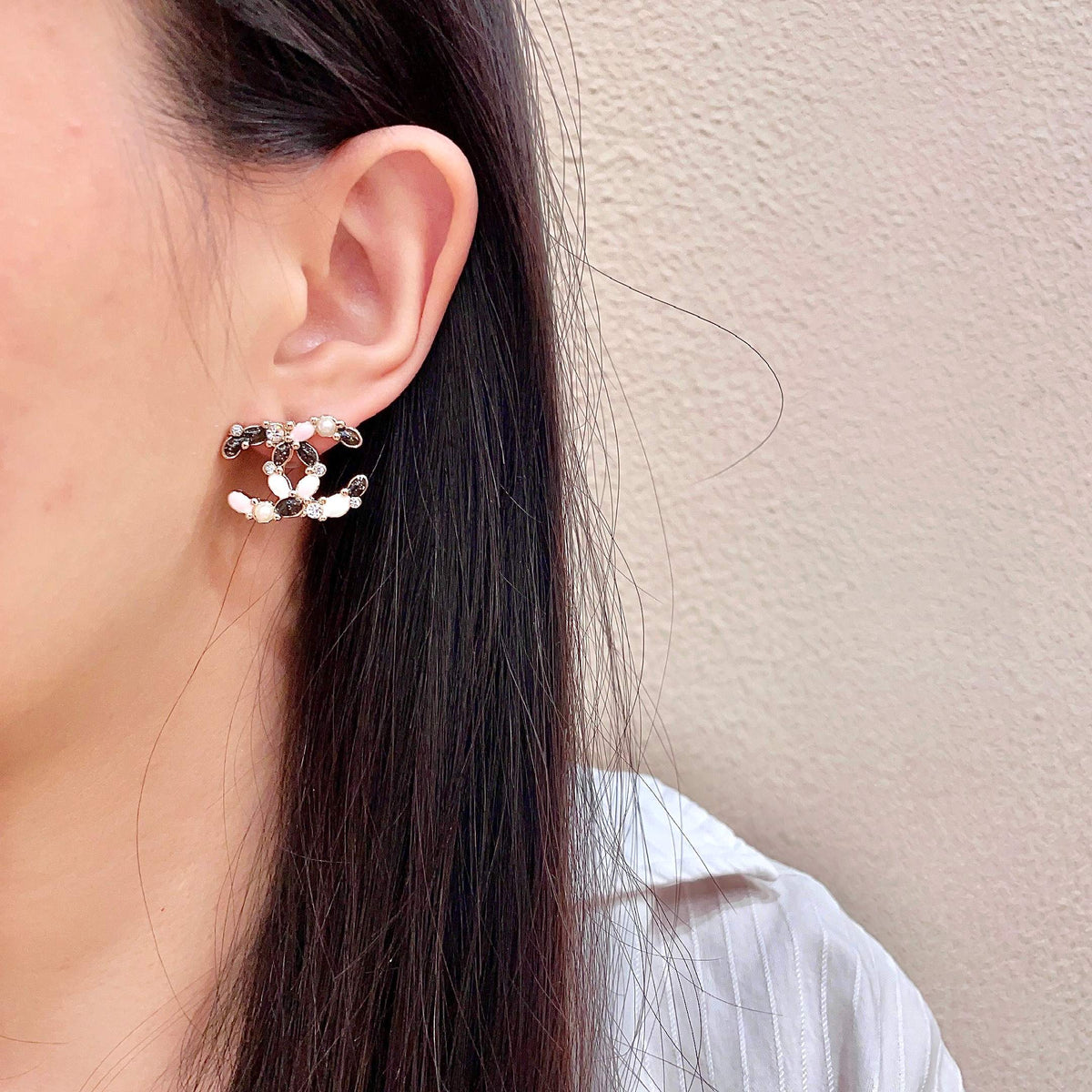 Martin Graham stud earrings in polished metal-tone – detail view