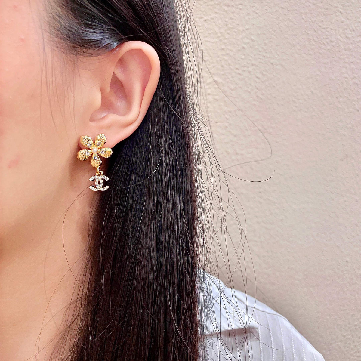 Martin Graham stud earrings in polished metal-tone – detail view