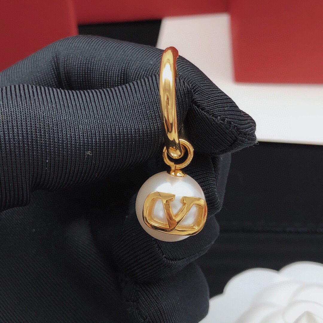 Martin Graham drop earrings in polished metal-tone – detail view