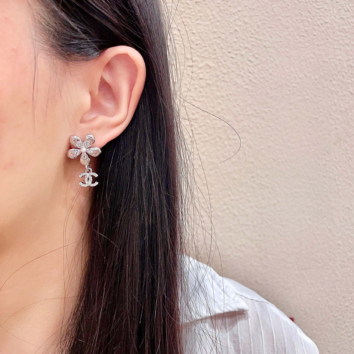 Martin Graham stud earrings in polished metal-tone – detail view