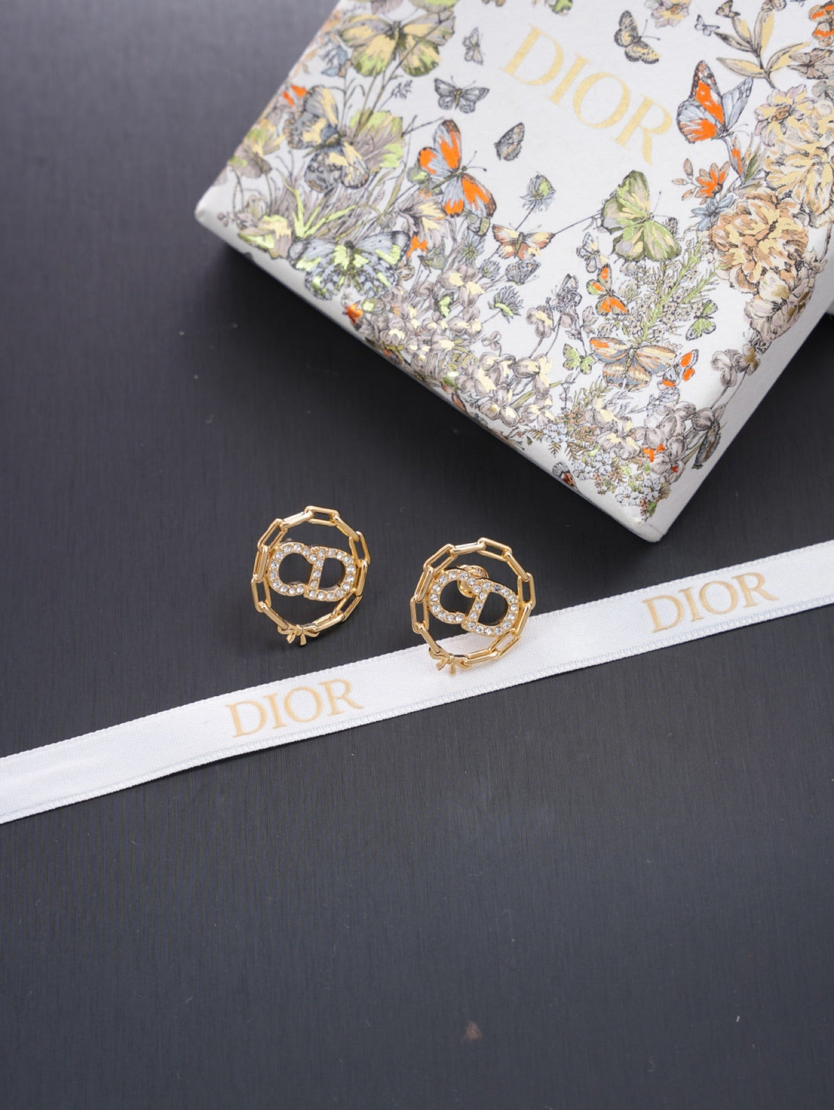 Martin Graham stud earrings in polished metal-tone – detail view