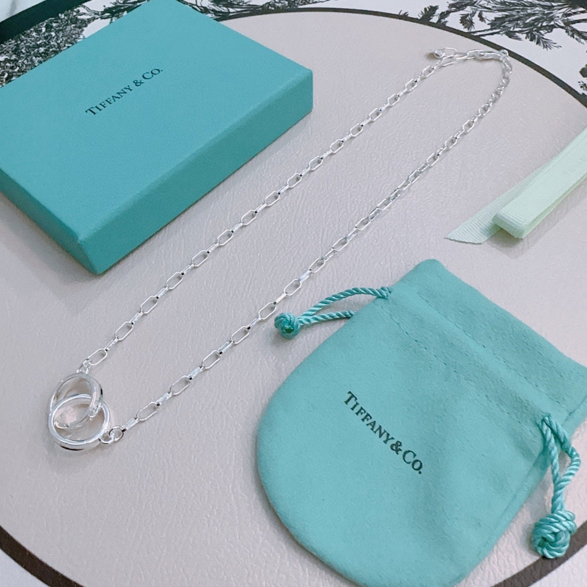 Martin Graham pendant necklace in polished metal-tone – detail view