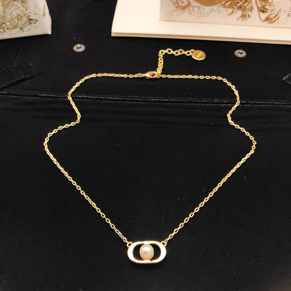 Martin Graham pendant necklace in polished metal-tone – detail view
