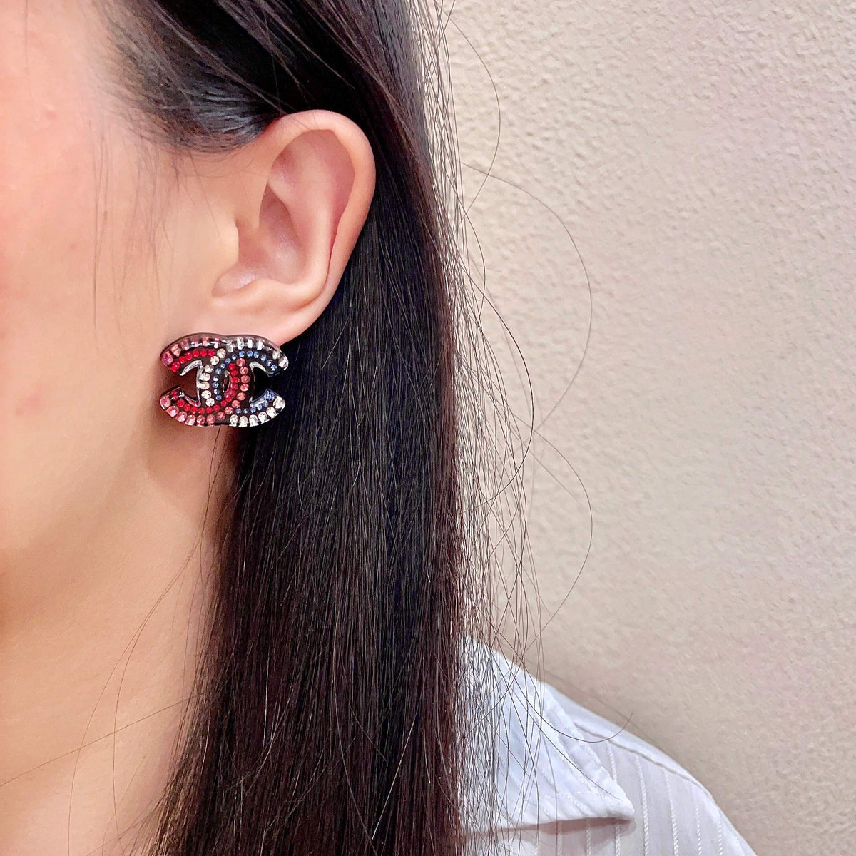 Martin Graham stud earrings in polished metal-tone – detail view
