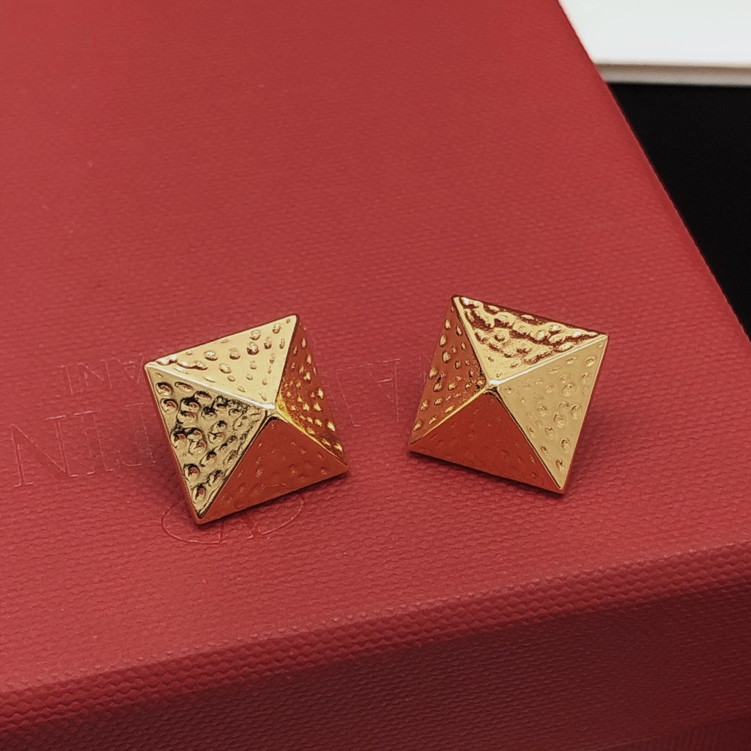 Martin Graham stud earrings in polished metal-tone – detail view