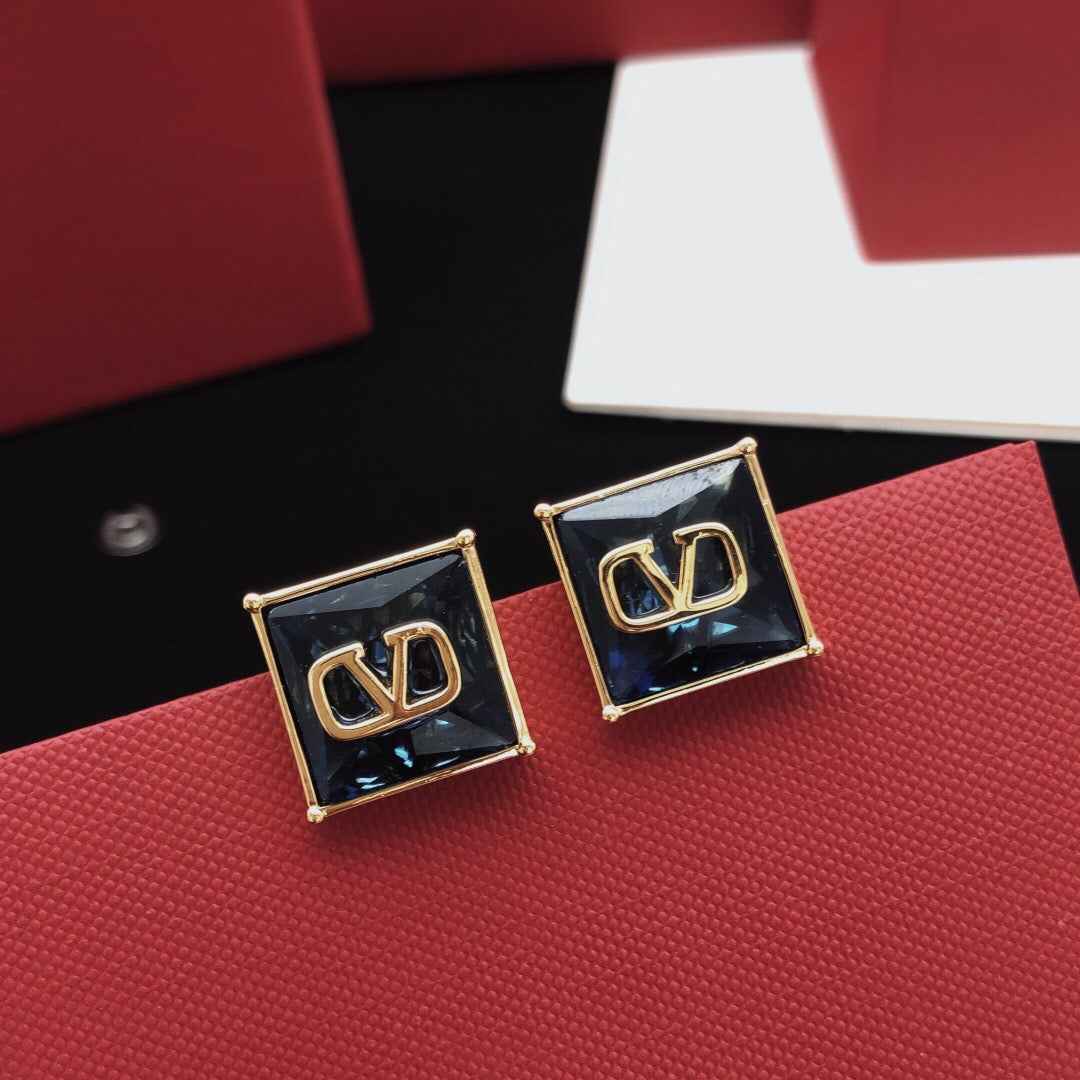 Martin Graham stud earrings in polished metal-tone – detail view