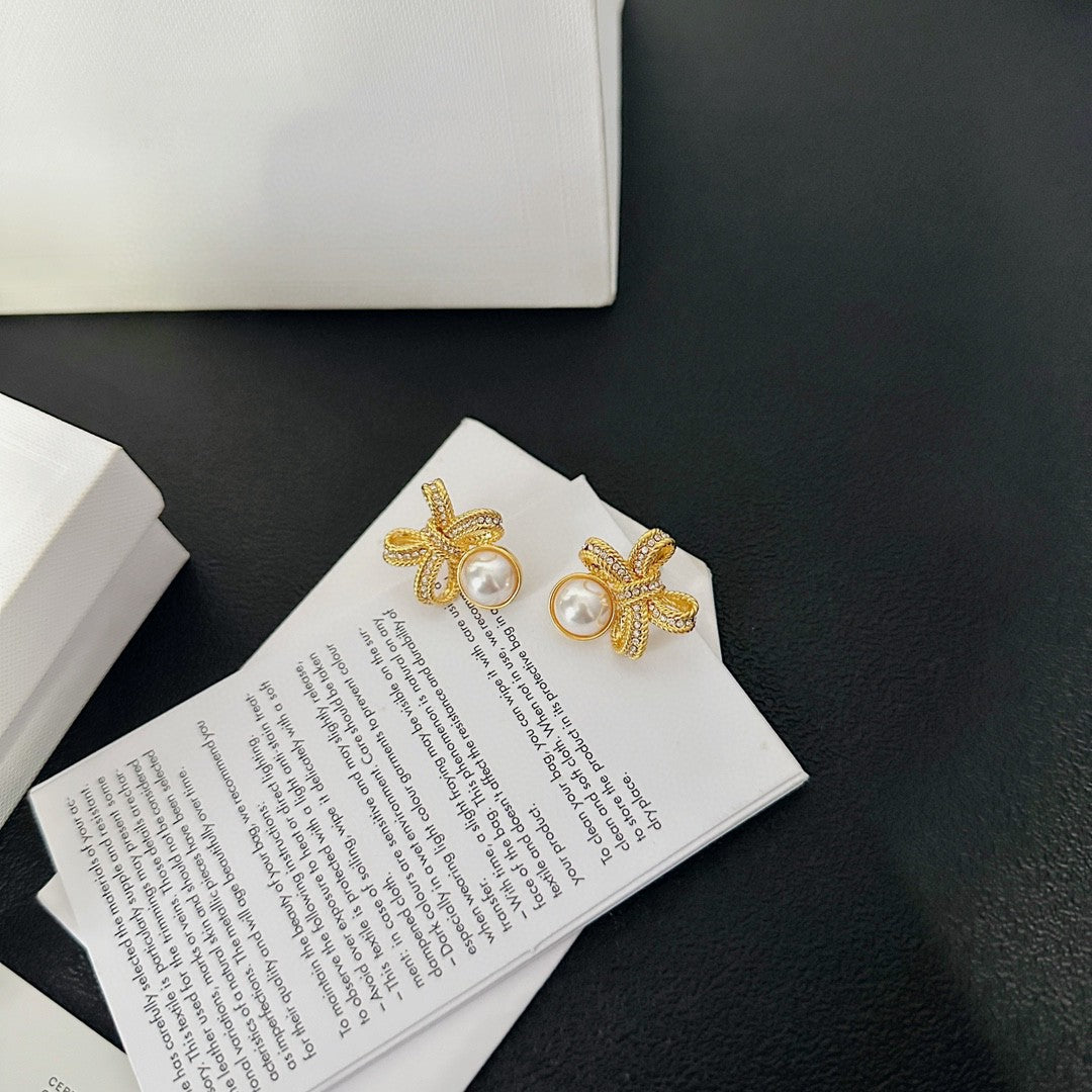 Martin Graham stud earrings in polished metal-tone – detail view