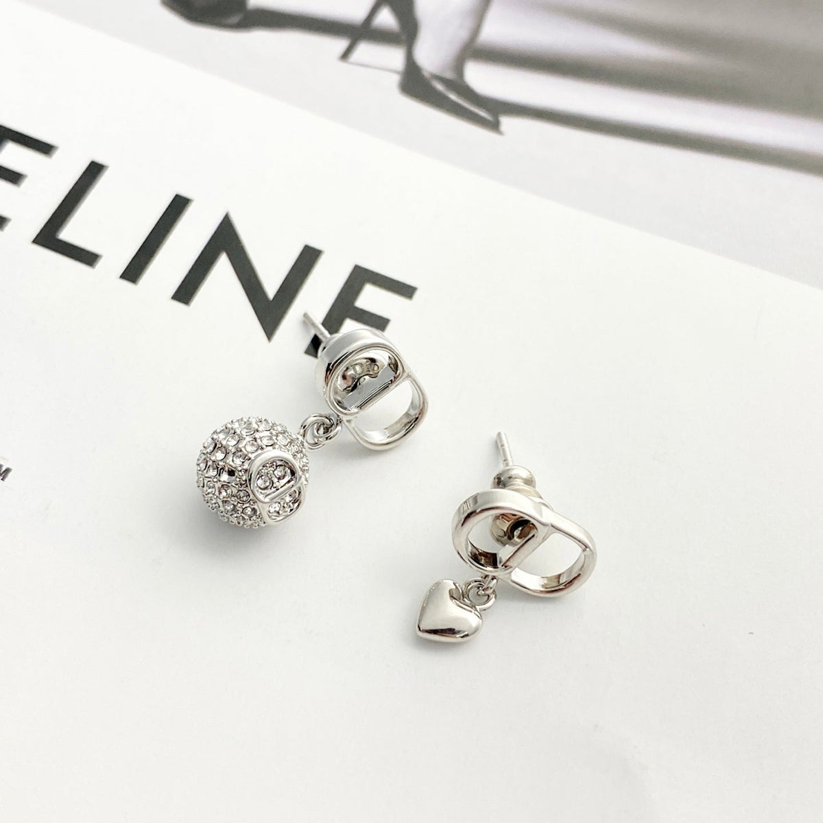 Martin Graham stud earrings in polished metal-tone – detail view