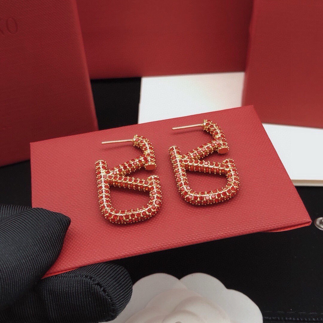 Martin Graham stud earrings in polished metal-tone – detail view