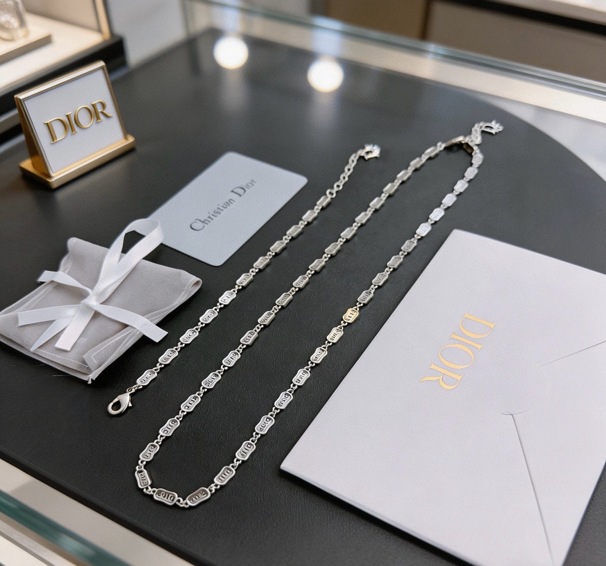 Martin Graham pendant necklace in polished metal-tone – detail view