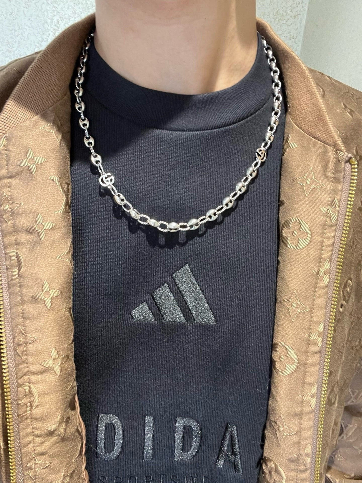 Martin Graham pendant necklace in polished metal-tone – detail view