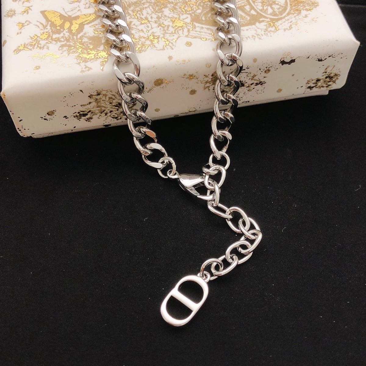 Martin Graham pendant necklace in polished metal-tone – detail view