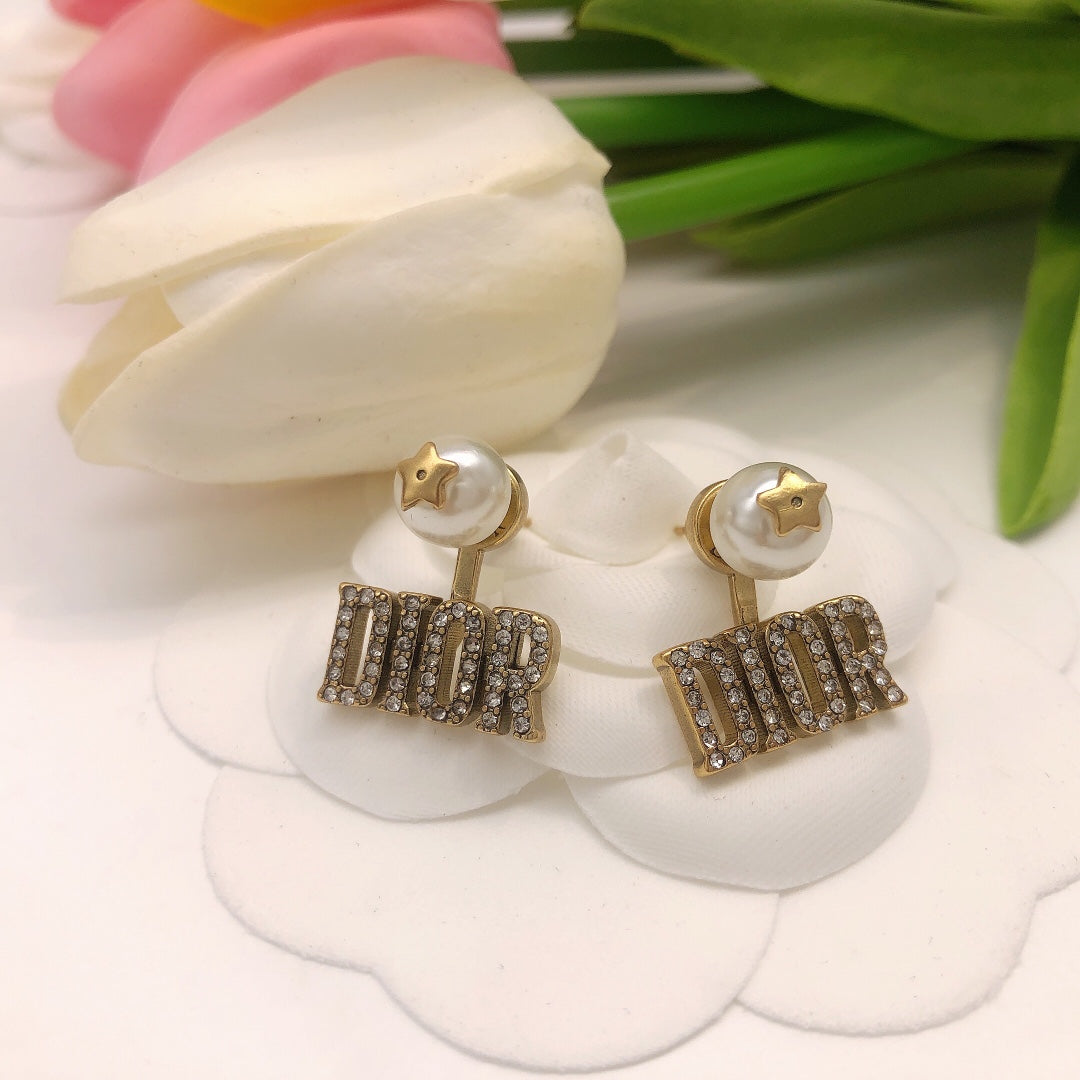 Martin Graham stud earrings in polished metal-tone – detail view