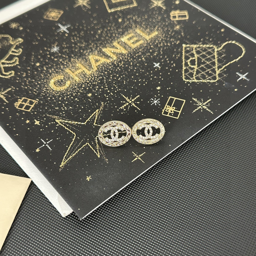 Martin Graham stud earrings in polished metal-tone – detail view