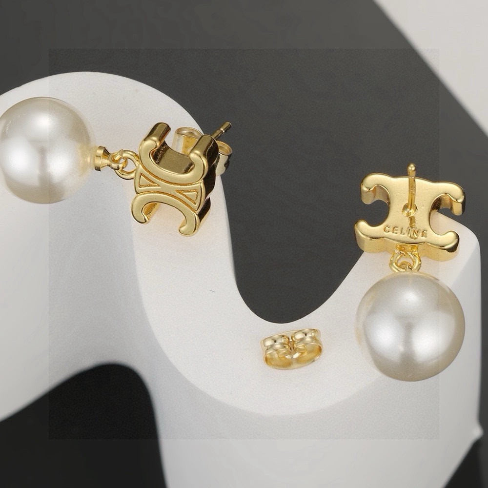 Martin Graham stud earrings in polished metal-tone – detail view