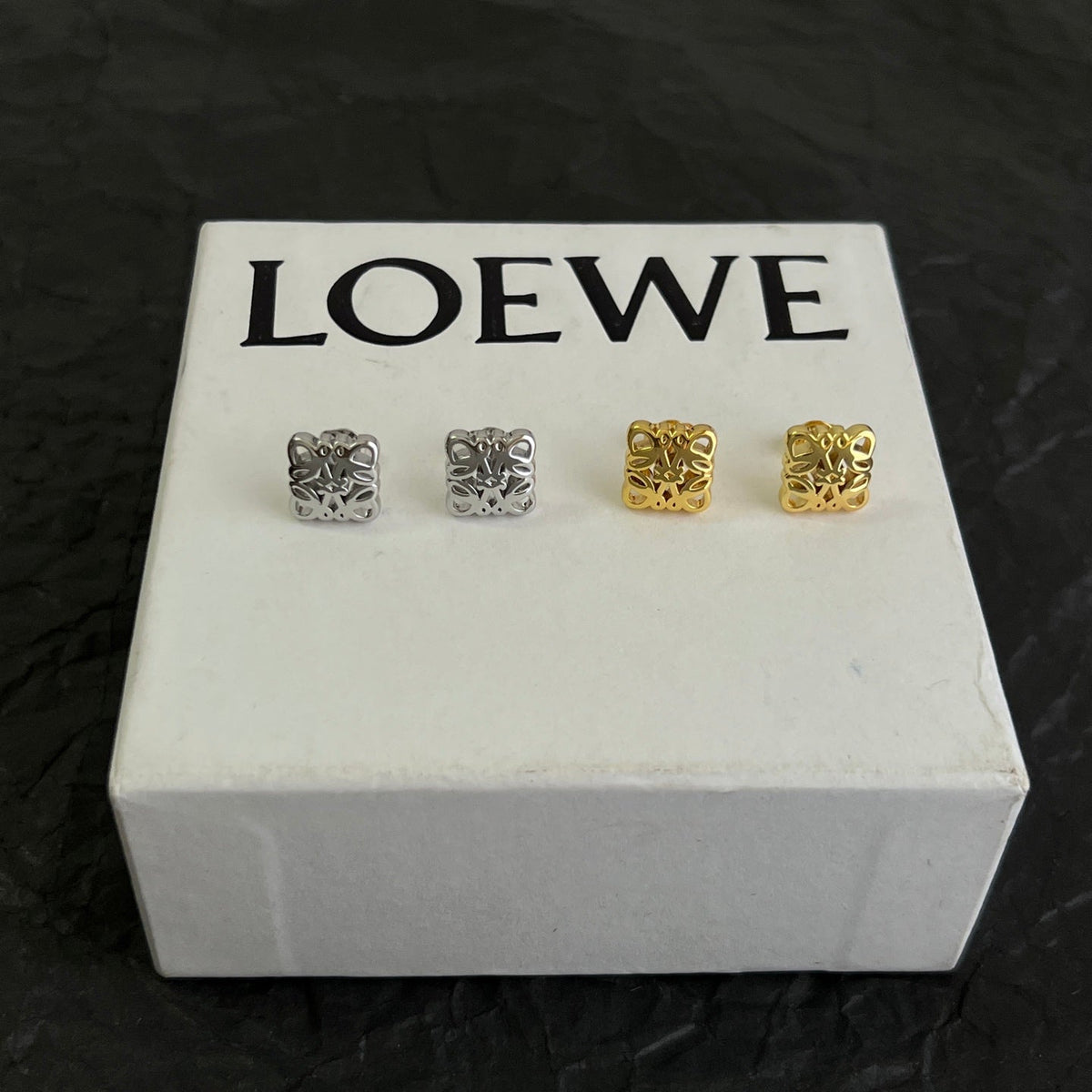 Martin Graham stud earrings in polished metal-tone – detail view