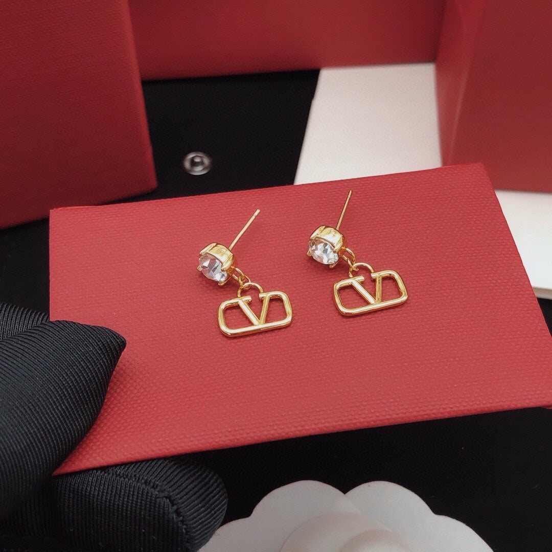 Martin Graham stud earrings in polished metal-tone – detail view
