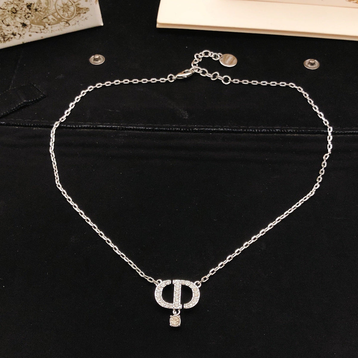Martin Graham pendant necklace in polished metal-tone – detail view