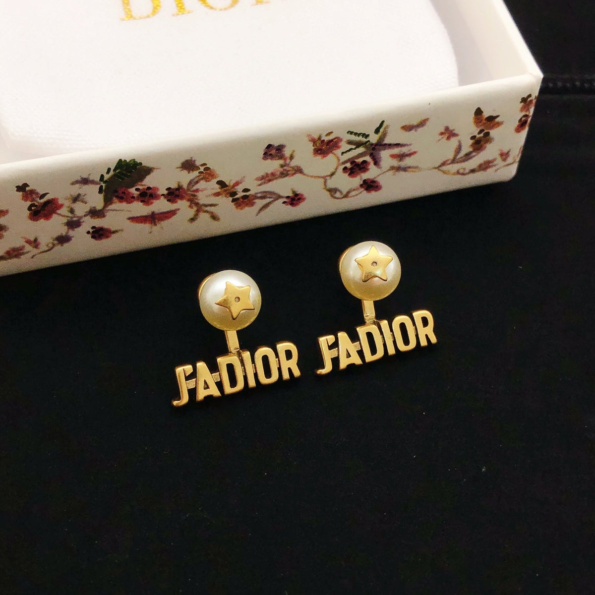 Martin Graham stud earrings in polished metal-tone – detail view