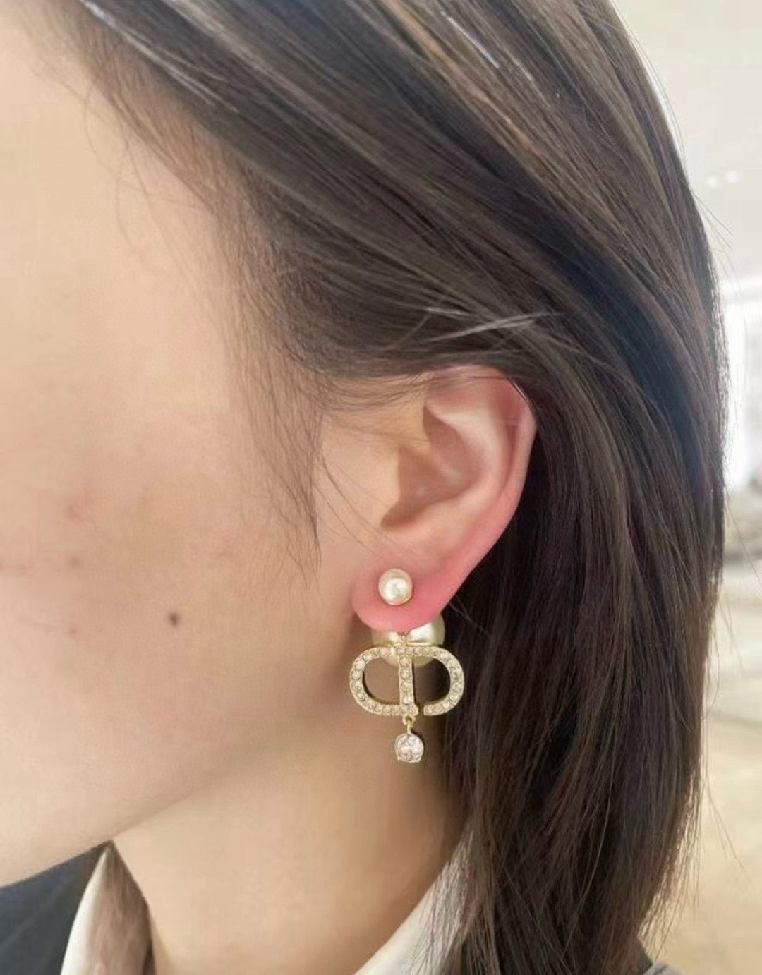 Martin Graham stud earrings in polished metal-tone – detail view