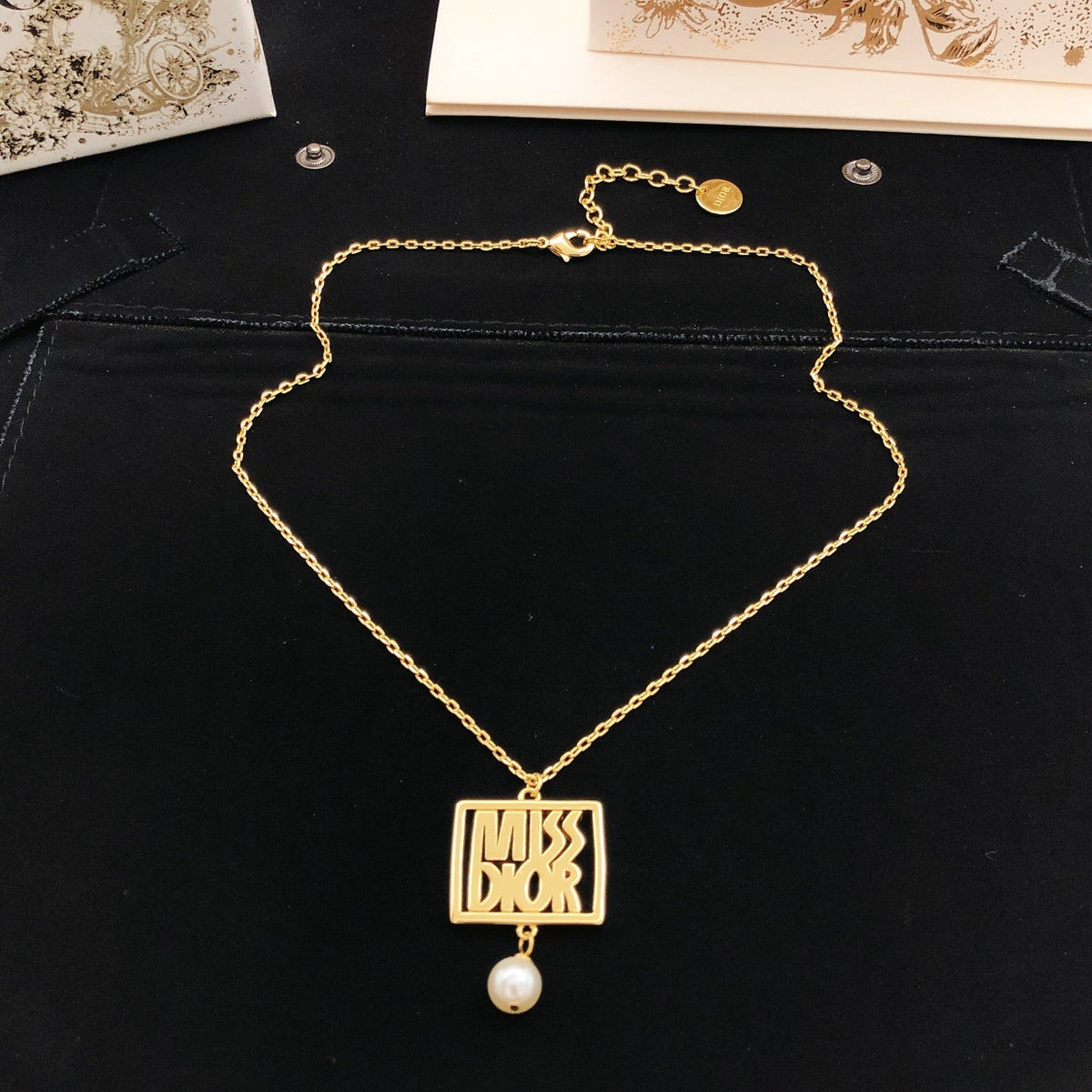Martin Graham pendant necklace in polished metal-tone – detail view