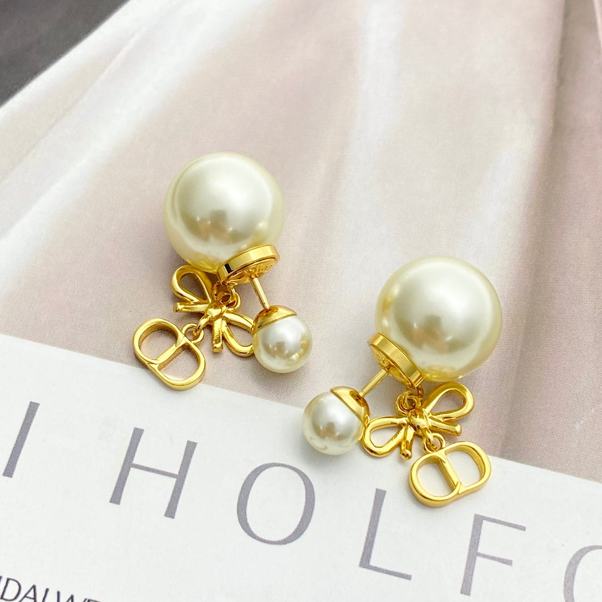 Martin Graham stud earrings in polished metal-tone – detail view